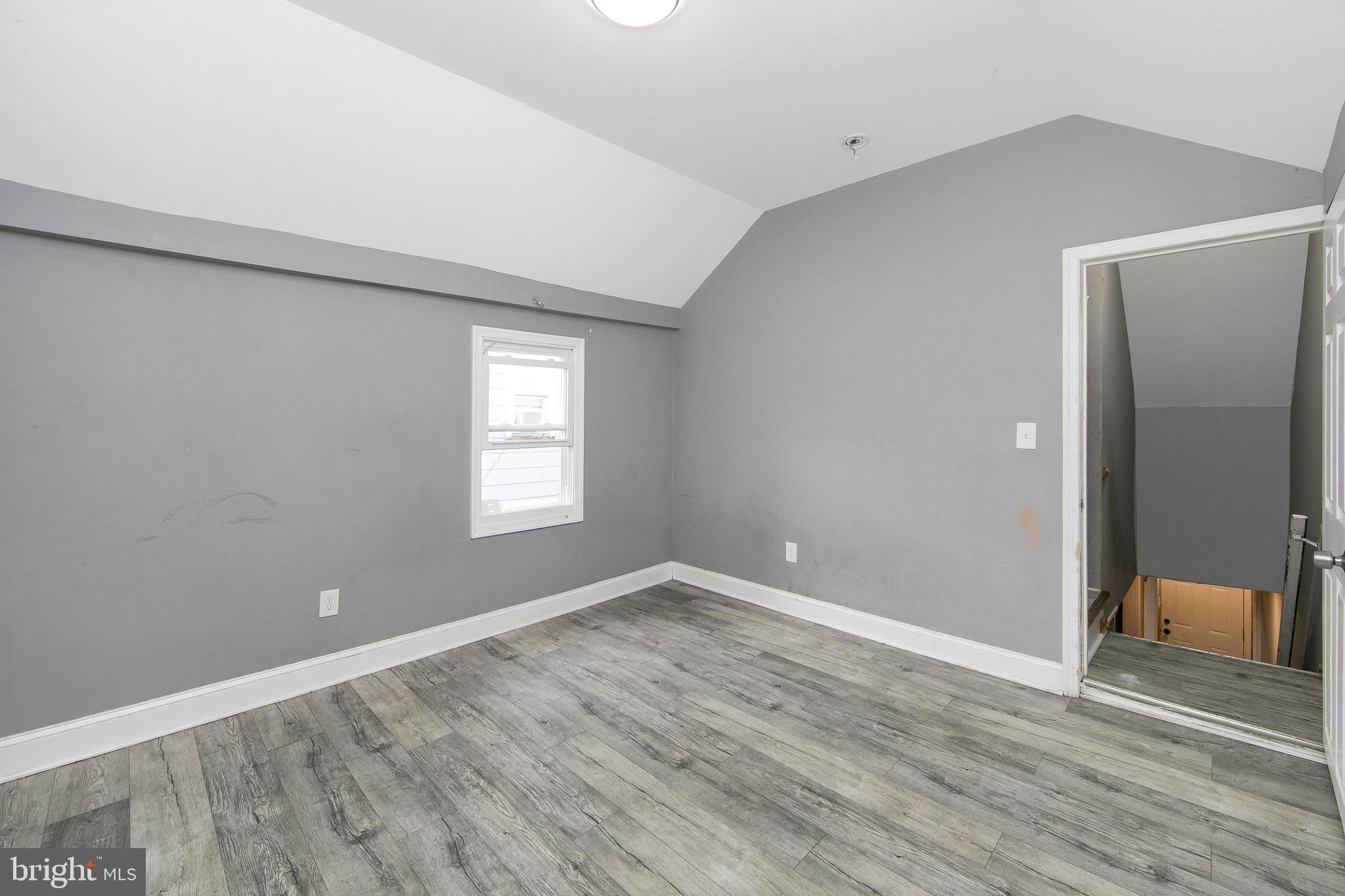 133 East Federal Street Burlington, NJ 08016 - Photo 25 of 43 a view of an empty room with wooden floor and a window