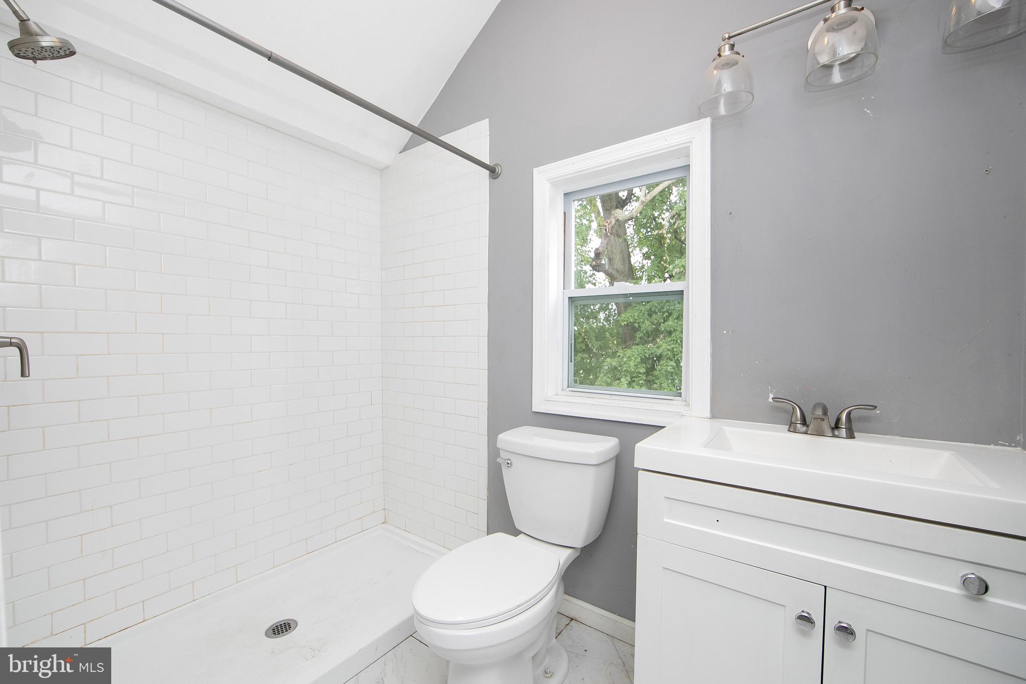 133 East Federal Street Burlington, NJ 08016 - Photo 26 of 43 a bathroom with a sink toilet vanity and window