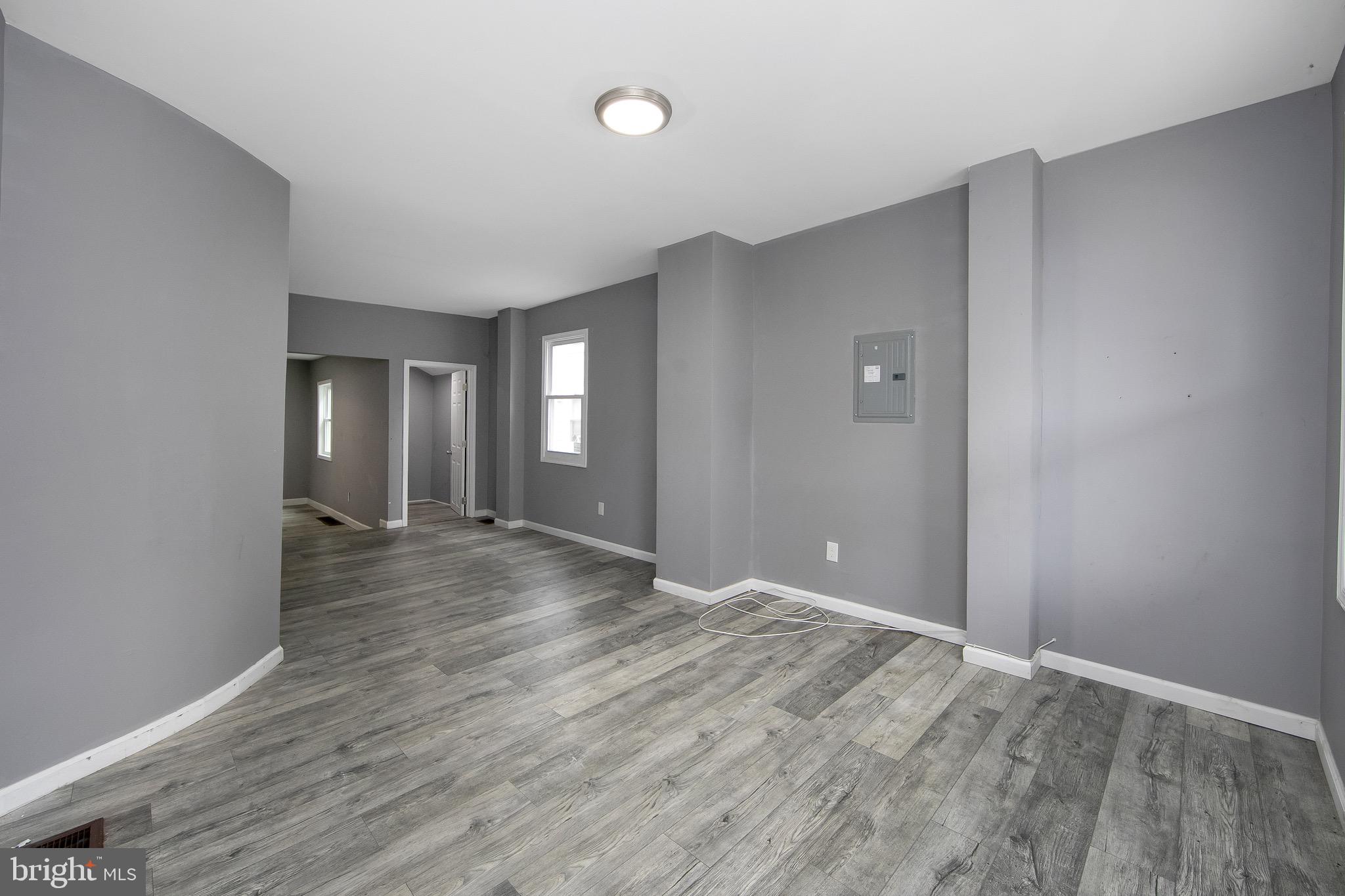 133 East Federal Street Burlington, NJ 08016 - Photo 6 of 43 a view of an empty room and window and wooden floor