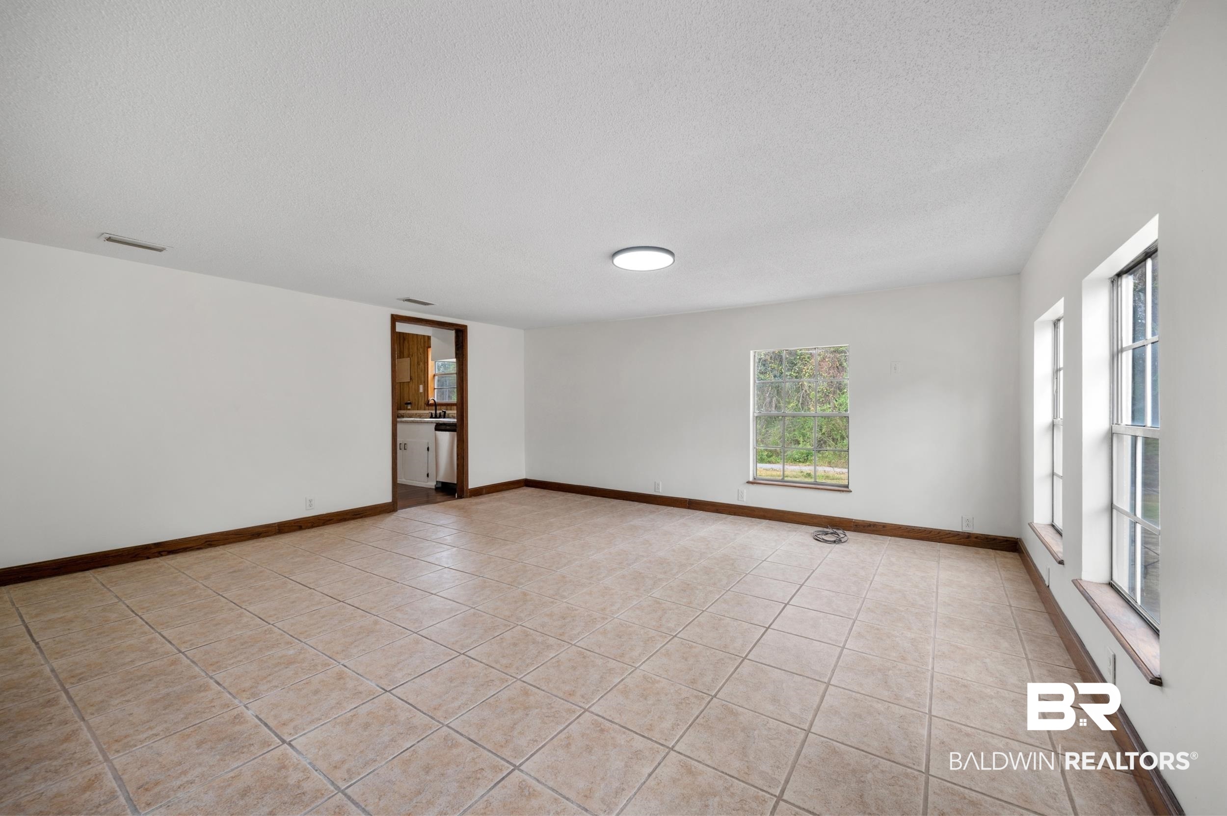 35780 Spring Road North Stapleton, AL 36578 - Photo 5 of 41 Unfurnished room with a textured ceiling and light tile patterned floors