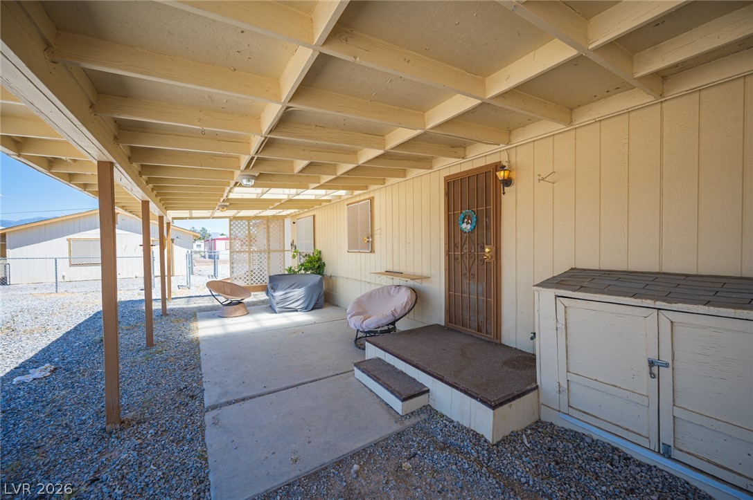 3200 Maple Road Pahrump, NV 89048 - Photo 43 of 53 A spacious covered patio provides a shaded outdoor living area with direct entry into the home.