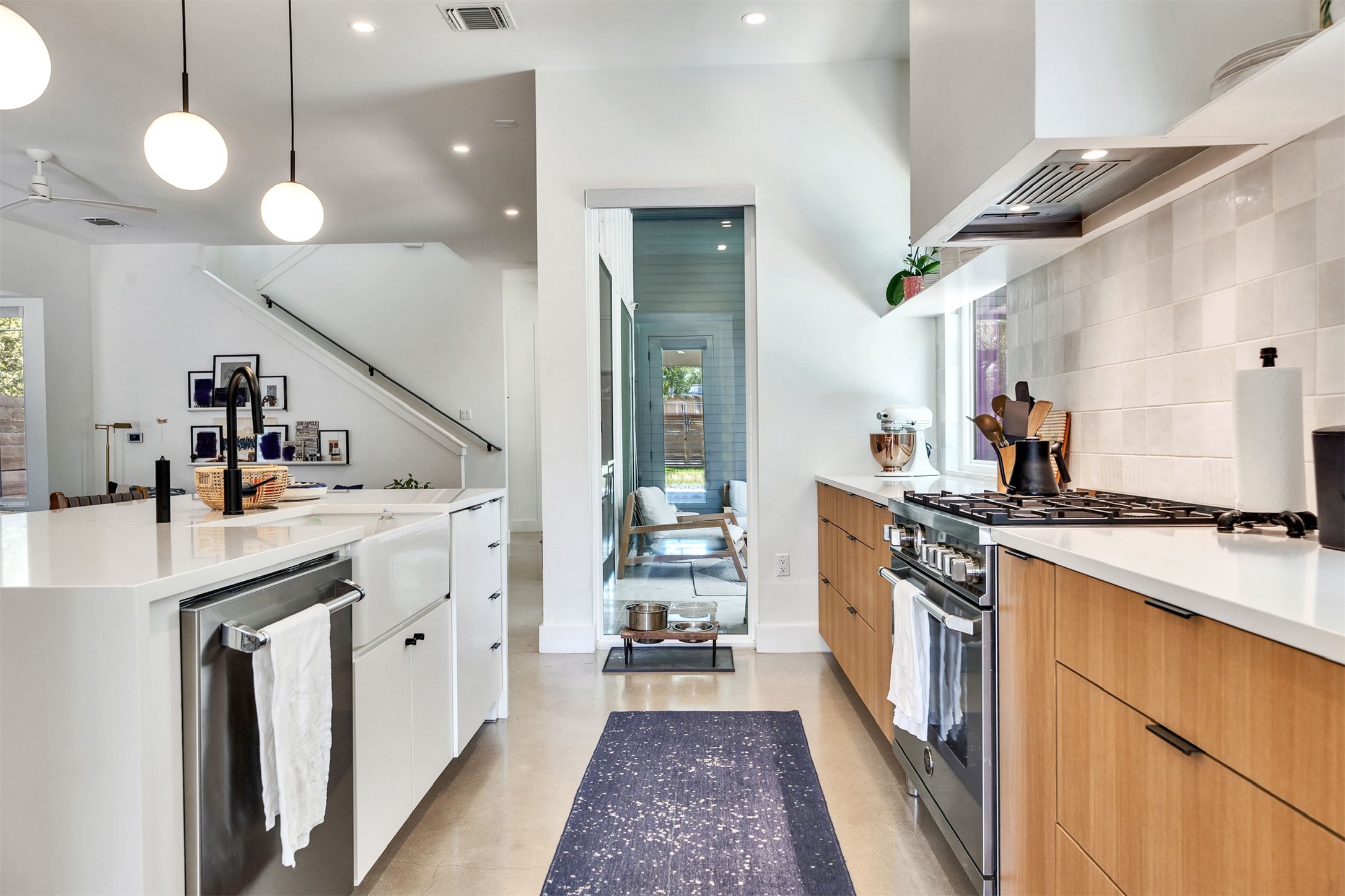 506 Powell Circle Austin, TX 78704 - Photo 18 of 39 a kitchen with stove a sink and refrigerator