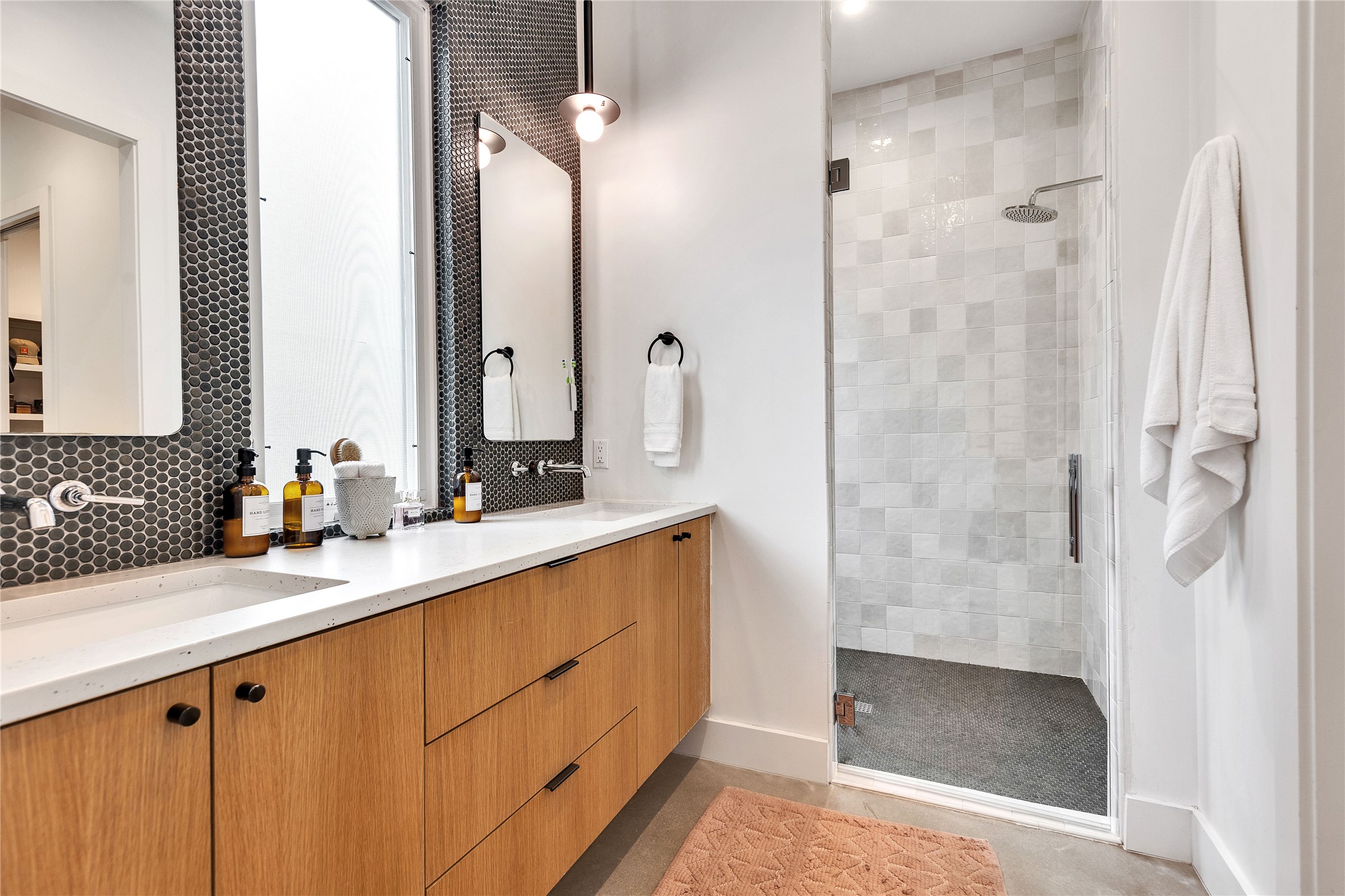 506 Powell Circle Austin, TX 78704 - Photo 27 of 39 a bathroom with a shower sink and mirror