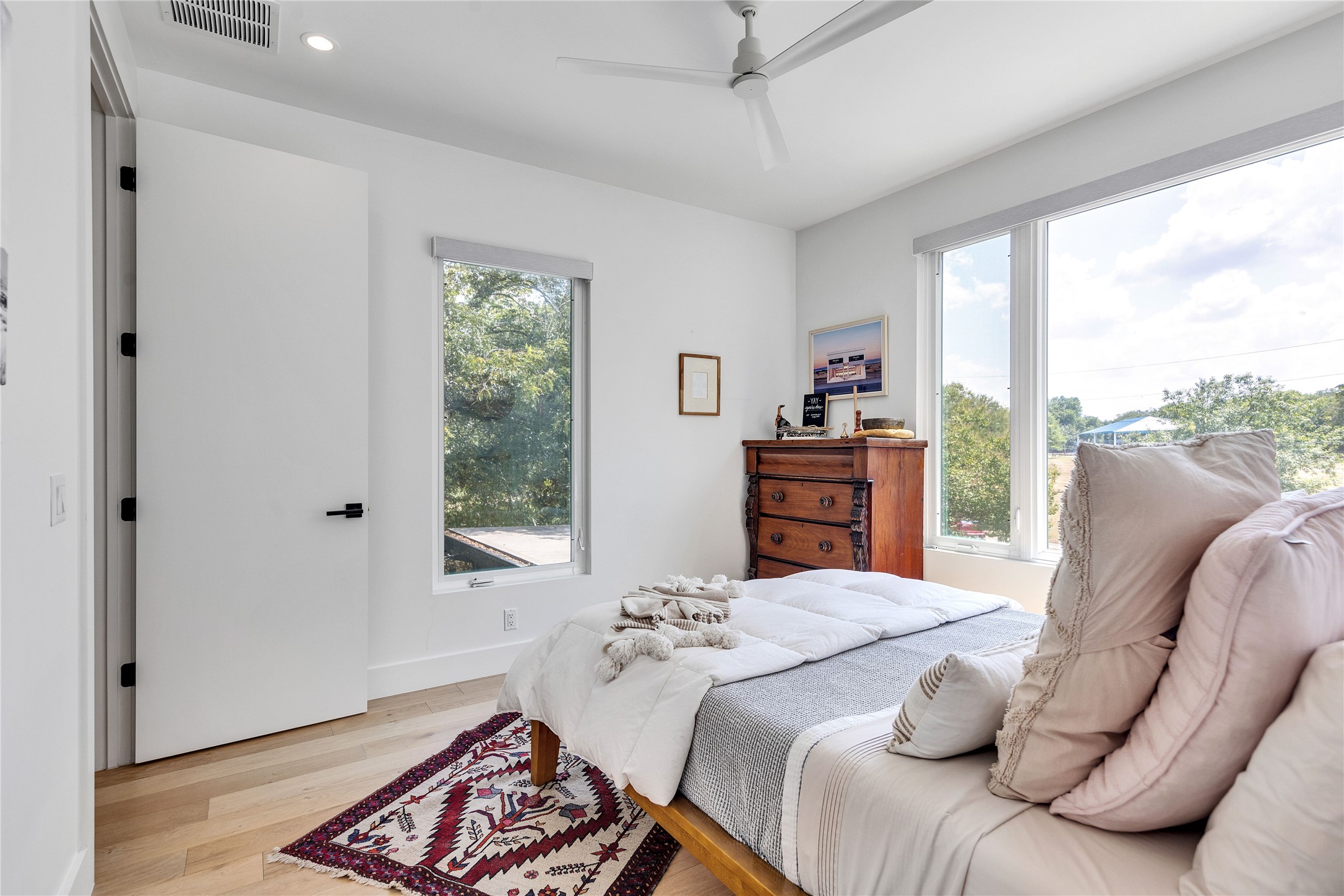 506 Powell Circle Austin, TX 78704 - Photo 33 of 39 a bedroom with a bed and wooden floor