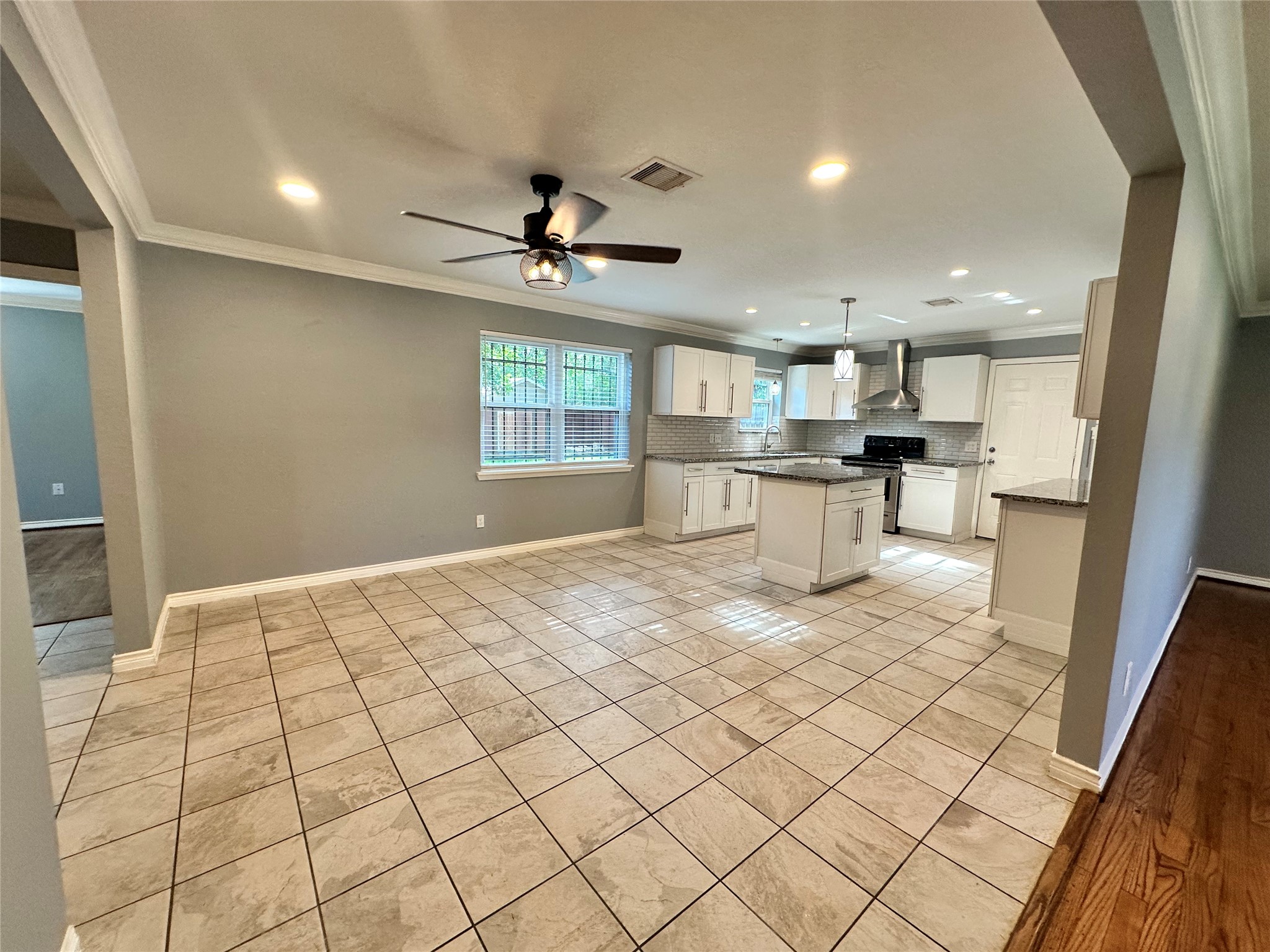2206 South Houston Road Pasadena, TX 77502 - Photo 5 of 11 a large white kitchen with a large window