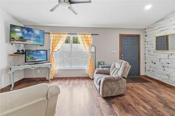 a front view of house with yard and green space