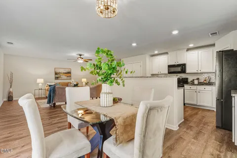 a dining room with furniture and window