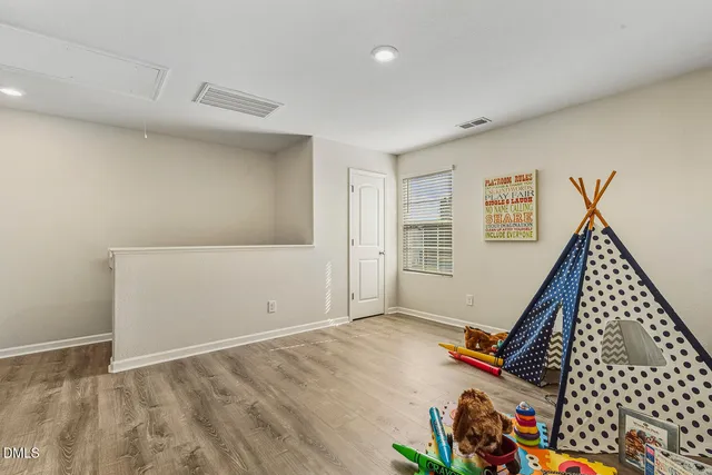 a view of a room with gym equipment and a window