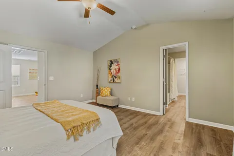 a bedroom with a large bed and a window