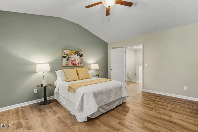 a bathroom with a double vanity sink toilet and shower