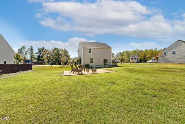 a view of a big room with table and chairs