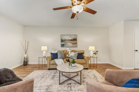 a living room with furniture and a rug