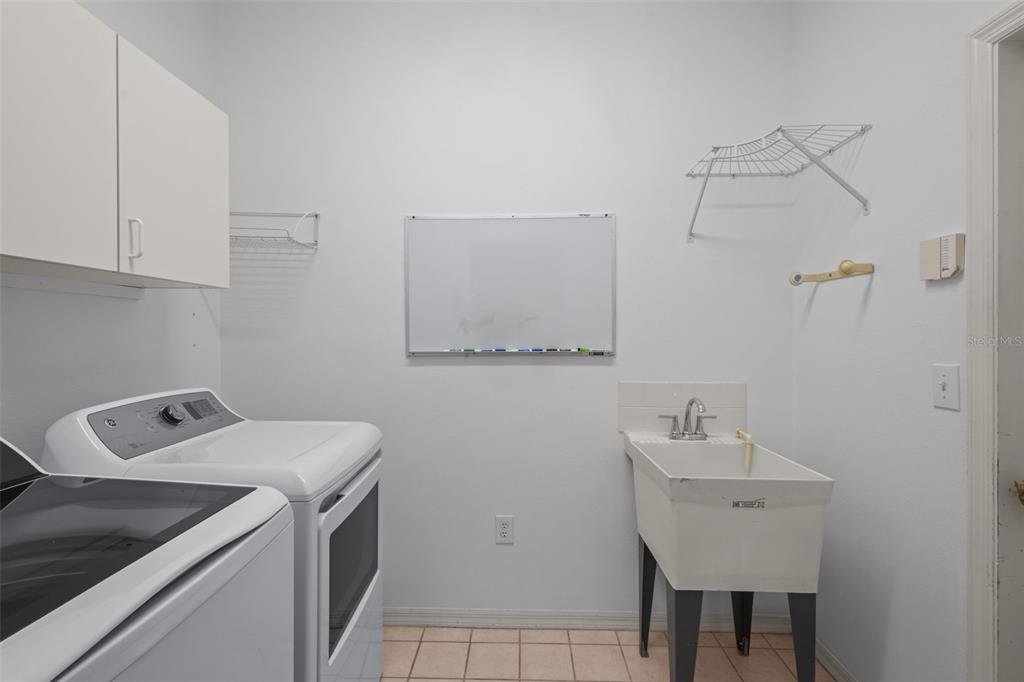 18543 Bittern Avenue Lutz, FL 33558 - Photo 12 of 45 a utility room with dryer and washer