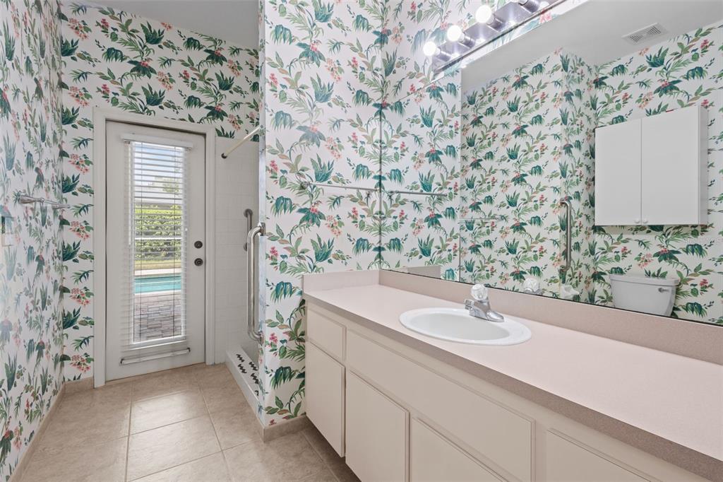 18543 Bittern Avenue Lutz, FL 33558 - Photo 17 of 45 a bathroom with a sink and a mirror