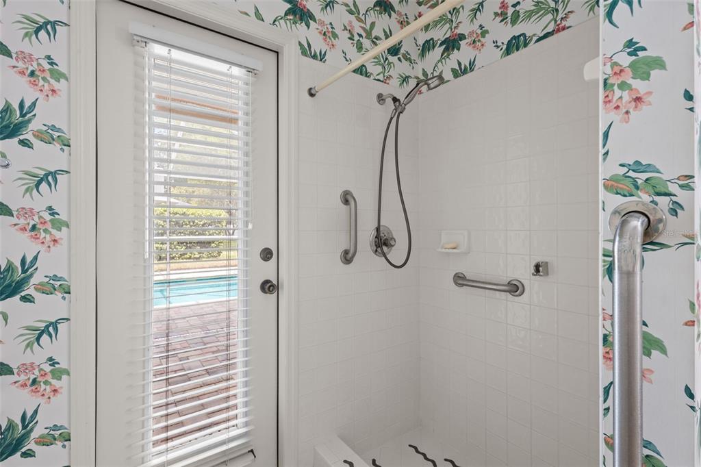 18543 Bittern Avenue Lutz, FL 33558 - Photo 18 of 45 a bathroom with a shower curtain and a window