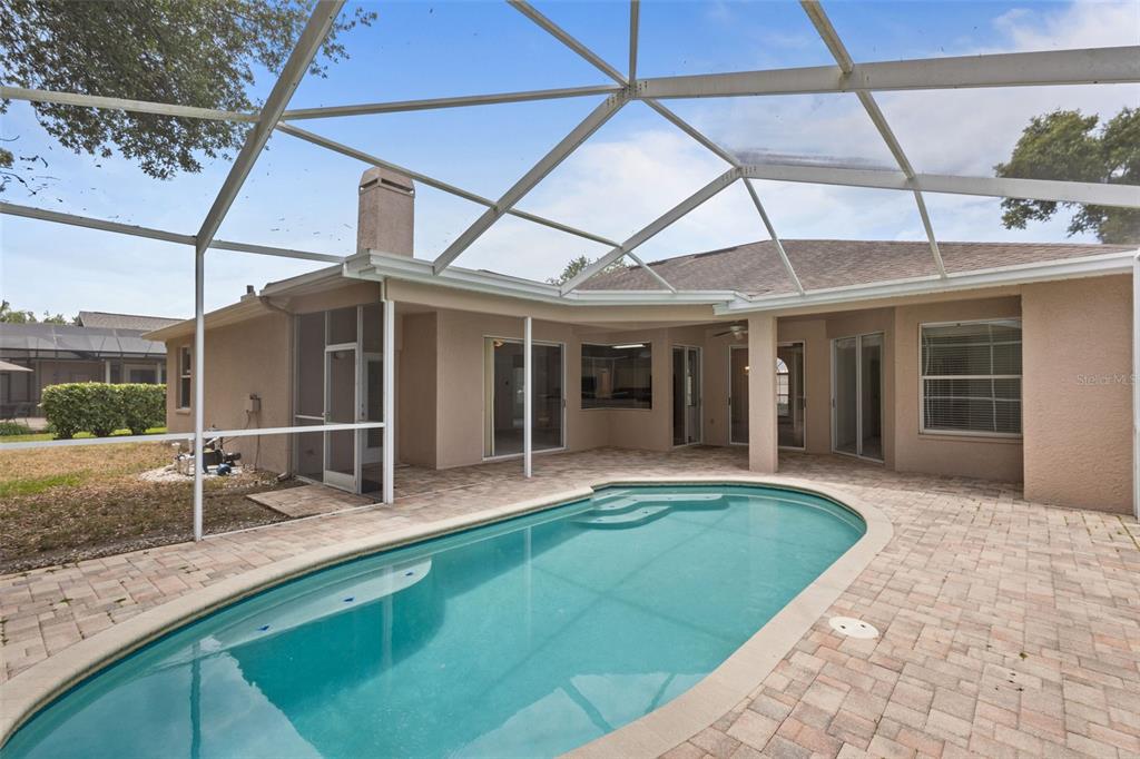 18543 Bittern Avenue Lutz, FL 33558 - Photo 19 of 45 a house view with a sitting space and garden space