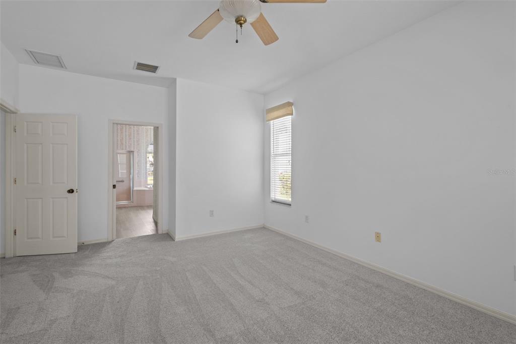 18543 Bittern Avenue Lutz, FL 33558 - Photo 36 of 45 a view of an empty room with a window