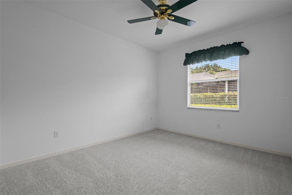 18543 Bittern Avenue Lutz, FL 33558 - Photo 39 of 45 an empty room with a window