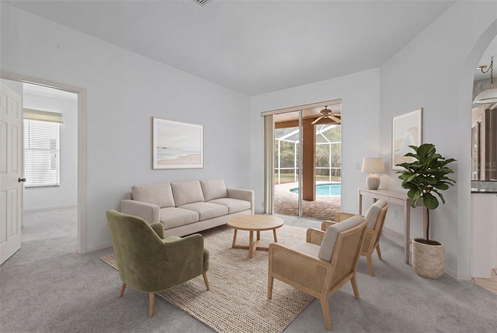 18543 Bittern Avenue Lutz, FL 33558 - Photo 4 of 45 a living room with furniture and a large window