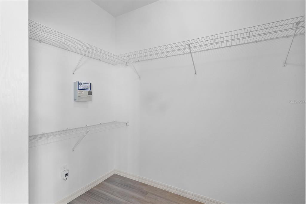 18543 Bittern Avenue Lutz, FL 33558 - Photo 9 of 45 a view of a room with racks on the wall