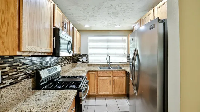 a view of a hallway with wooden floor and entryway