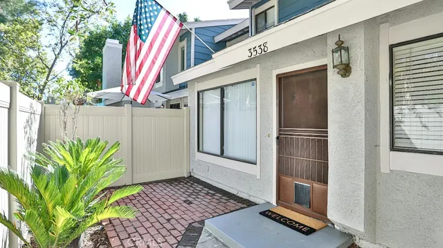 a view of a house with a door and wooden floor