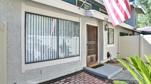 a view of balcony with wooden floor and flowers