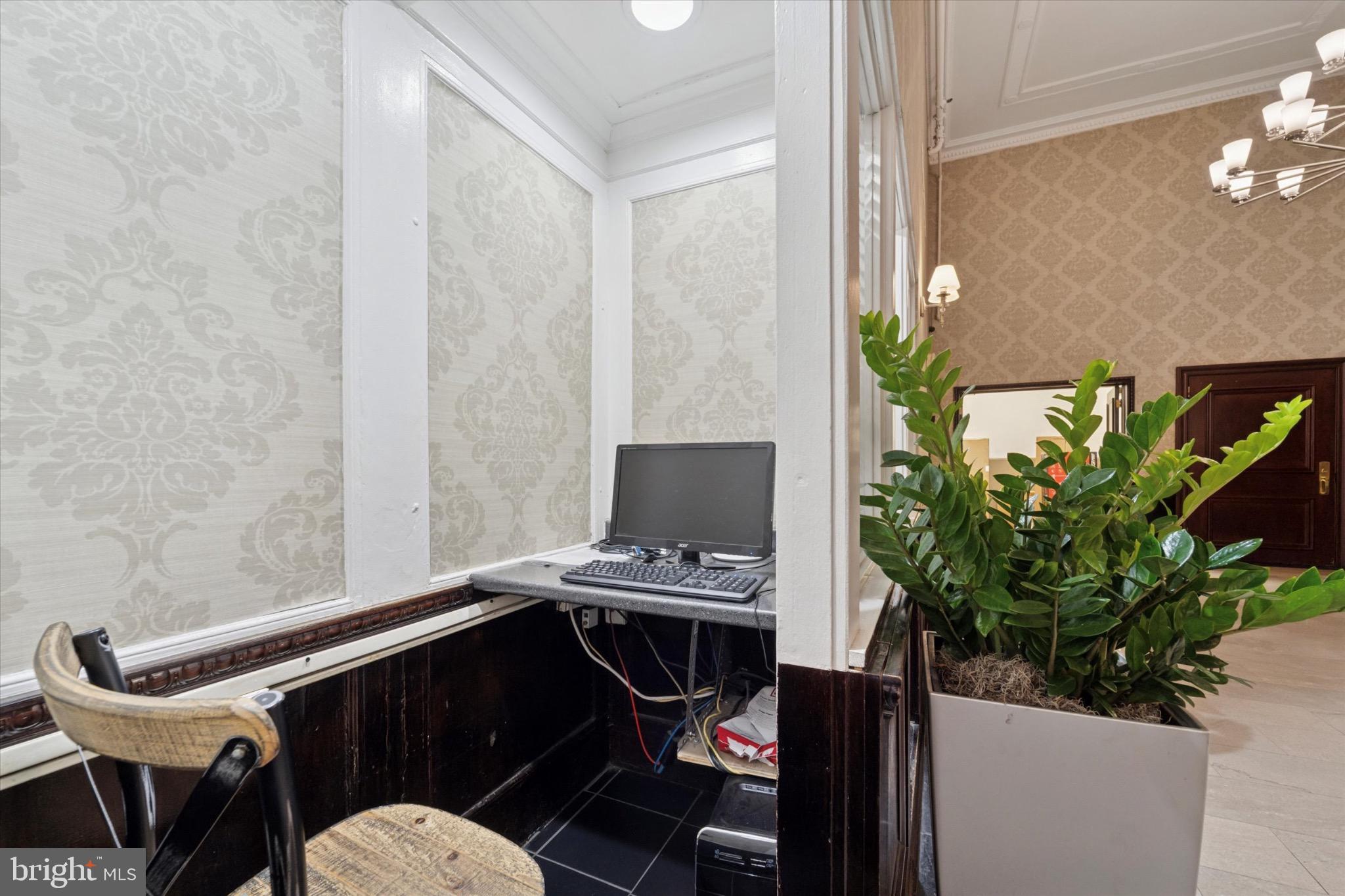 1324 Locust Street, Unit 1121 Philadelphia, PA 19107 - Photo 12 of 25 Cozy workspace with greenery accents.