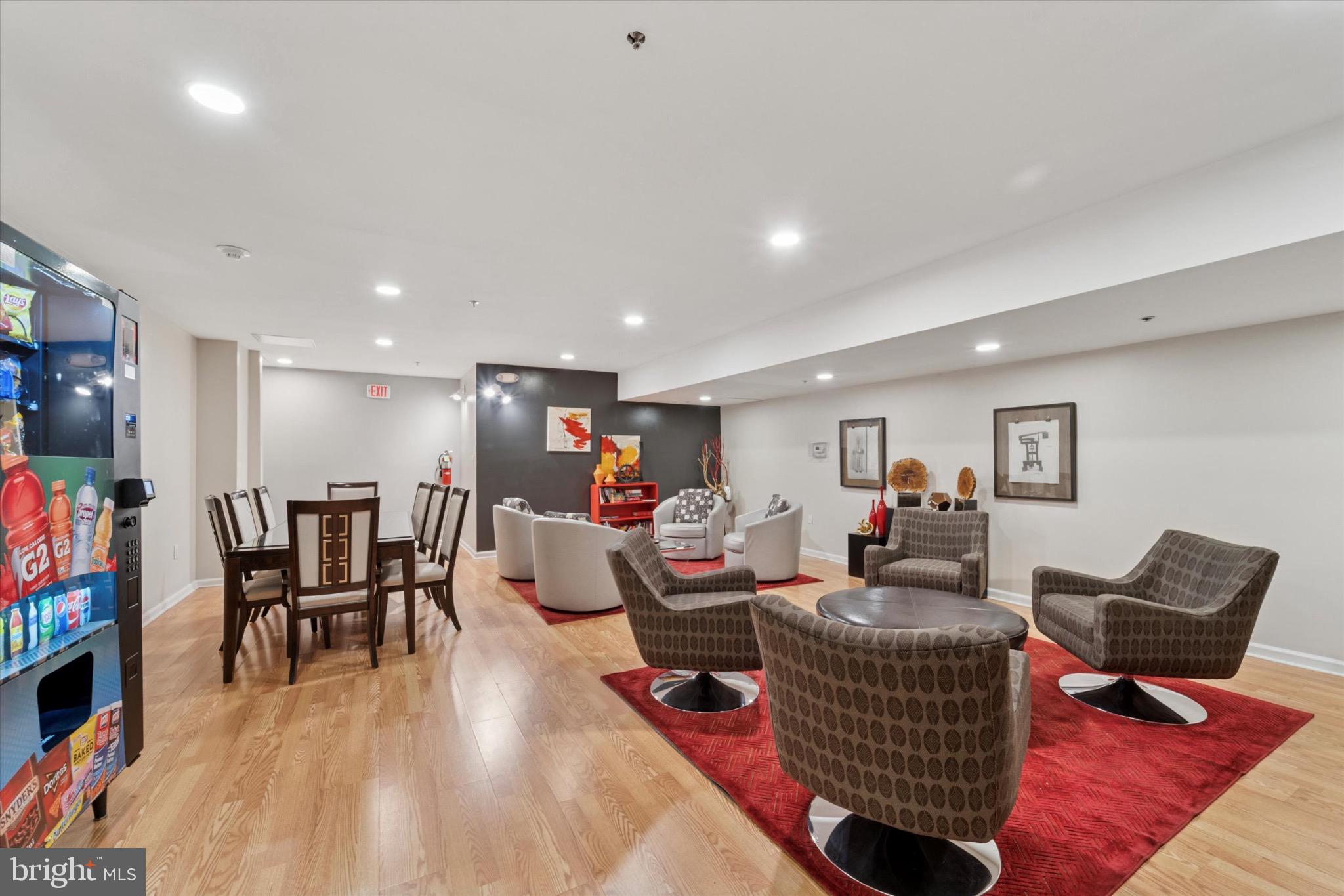 1324 Locust Street, Unit 1121 Philadelphia, PA 19107 - Photo 21 of 25 Modern lounge with vibrant decor and seating.