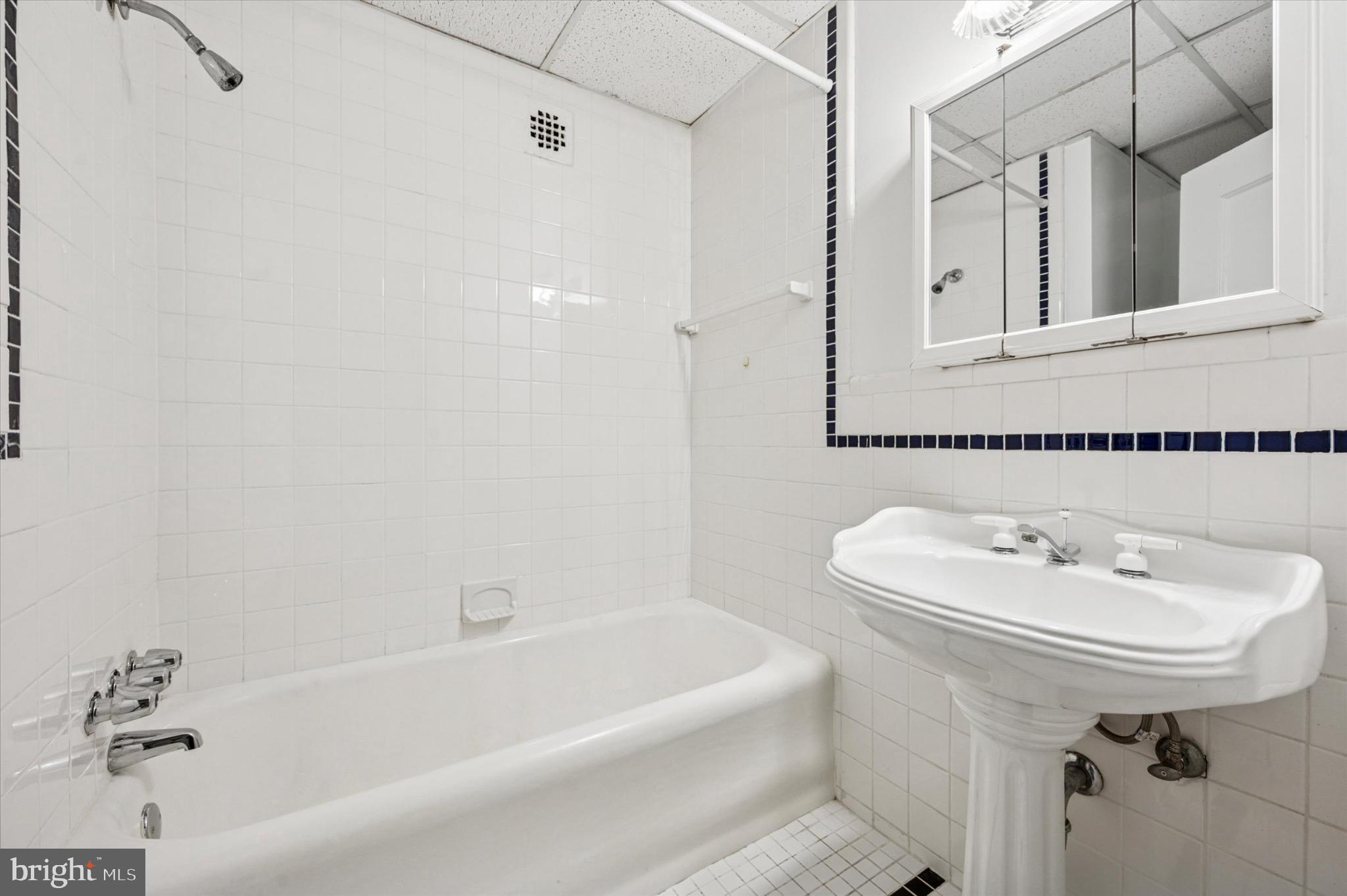 1324 Locust Street, Unit 1121 Philadelphia, PA 19107 - Photo 7 of 25 Bright and clean bathroom with classic tiles.