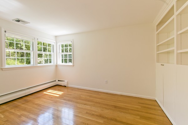 76 Sunset Road Carlisle, MA 01741 - Photo 15 of 29 an empty room with a window