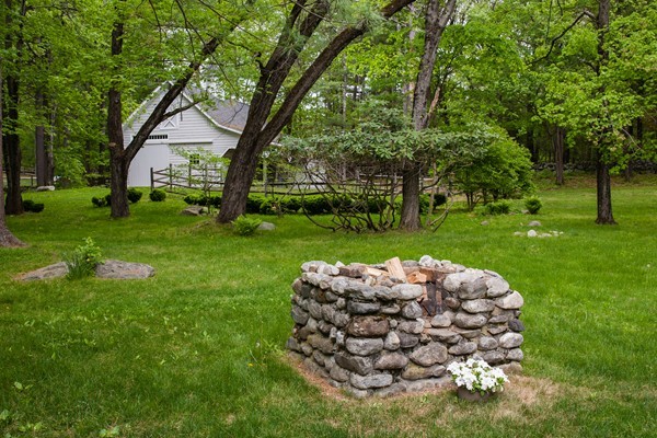 76 Sunset Road Carlisle, MA 01741 - Photo 27 of 29 a view of a white house with a yard