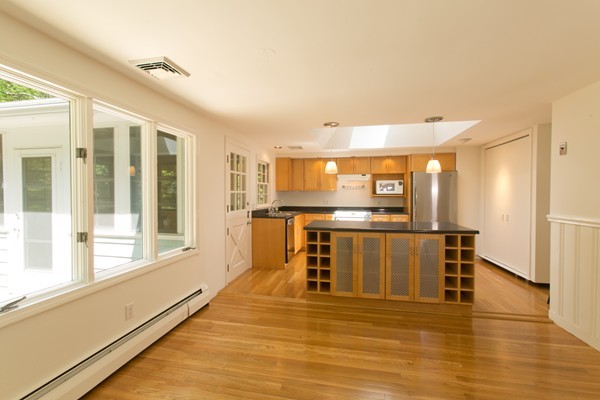 76 Sunset Road Carlisle, MA 01741 - Photo 5 of 29 a view of a kitchen with a sink and microwave