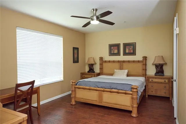 a bedroom with a bed and a table in it