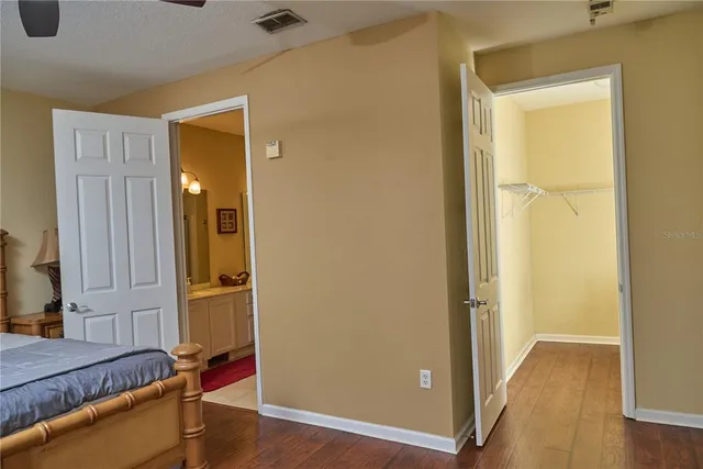 a view of bedroom with furniture and wooden floor