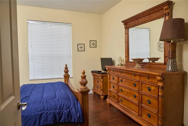 a bed room with a bed and a television