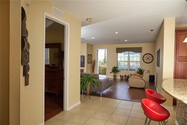 a lobby with furniture and a potted plant