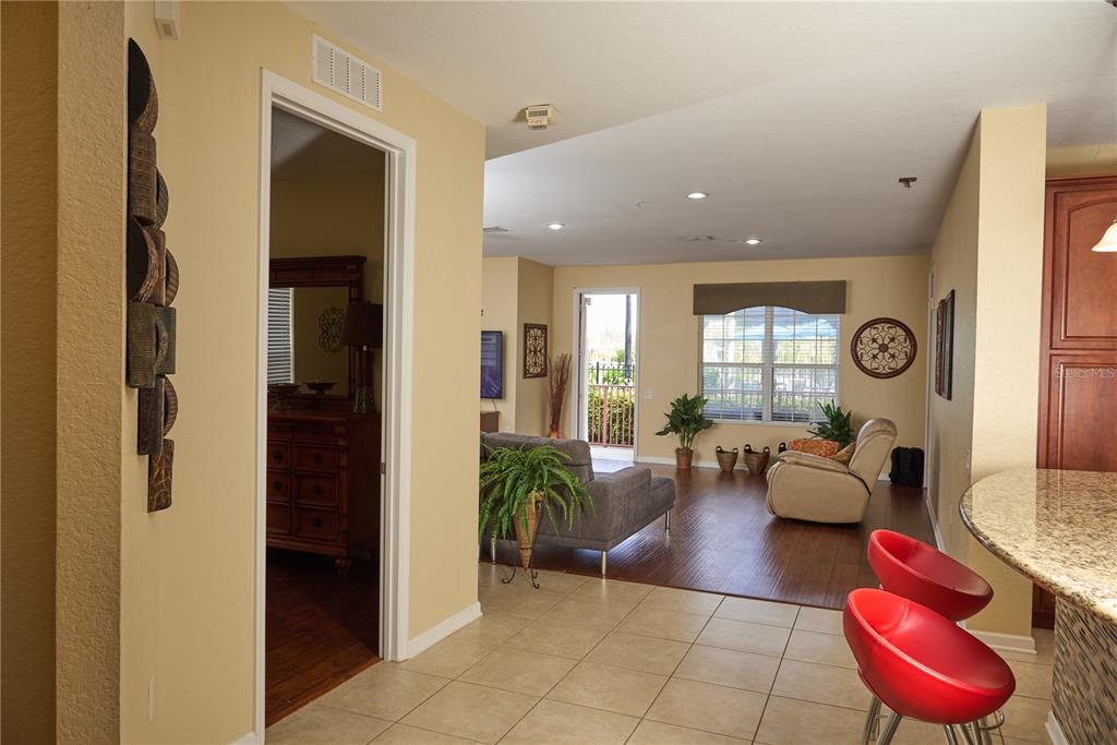 5012 Shoreway Loop, Unit 10407 Orlando, FL 32819 - Photo 9 of 35 a lobby with furniture and a potted plant