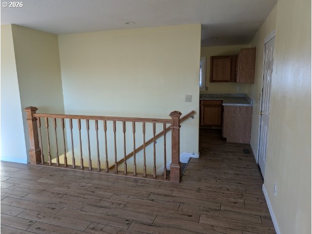 1380 Detroit Street Elgin, OR 97827 - Photo 14 of 28 a view of a hallway with wooden floor and a bathroom