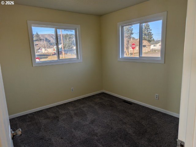 1380 Detroit Street Elgin, OR 97827 - Photo 18 of 28 an empty room with windows