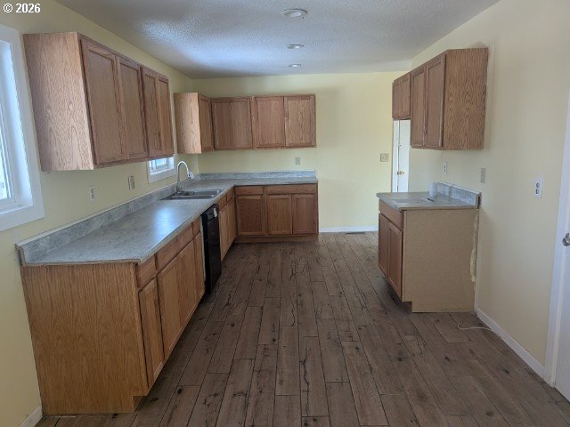 1380 Detroit Street Elgin, OR 97827 - Photo 5 of 28 a kitchen with wooden floors and wooden cabinets