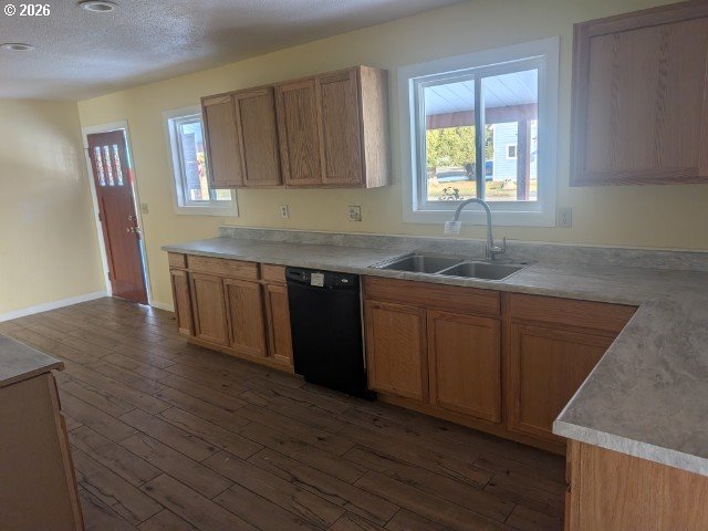 1380 Detroit Street Elgin, OR 97827 - Photo 6 of 28 a kitchen with stainless steel appliances granite countertop wooden cabinets a sink and dishwasher with wooden floor