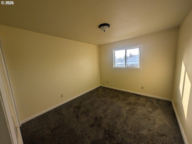 1380 Detroit Street Elgin, OR 97827 - Photo 9 of 28 an empty room with a empty space and windows