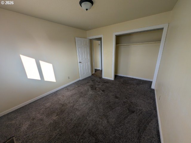 1380 Detroit Street Elgin, OR 97827 - Photo 10 of 28 an empty room with a empty space and windows