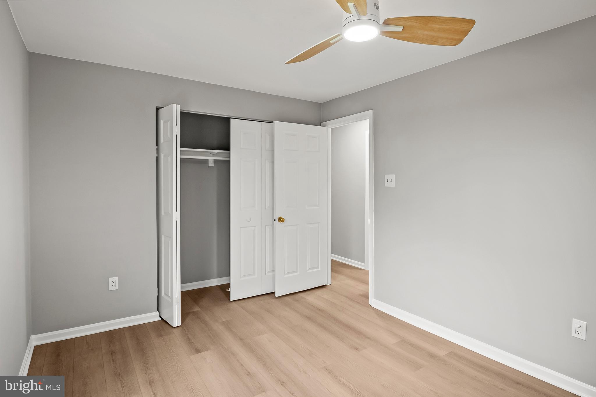 10153 High Ridge Road Laurel, MD 20723 - Photo 33 of 58 an empty room with wooden floor and windows