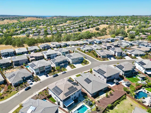 a stove top oven sitting inside of a kitchen
