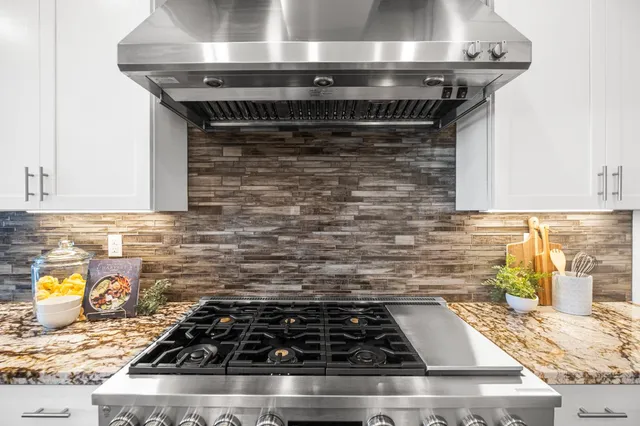 a bathroom with a shower curtain a sink and a mirror