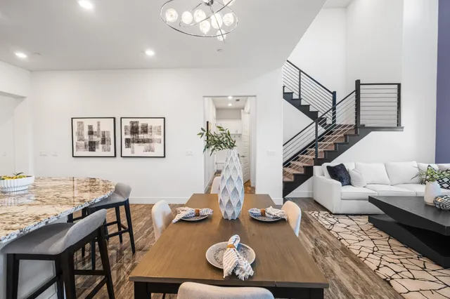 a white toilet sitting next to a white cabinet