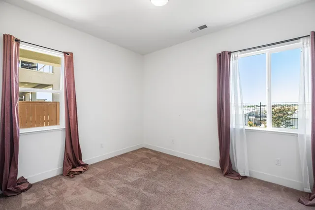 a bathroom with a sink double vanity granite tub shower and a mirror