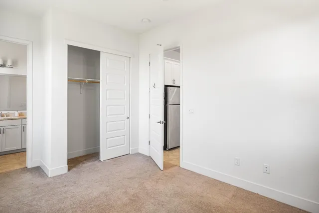a white toilet sitting next to a bath tub
